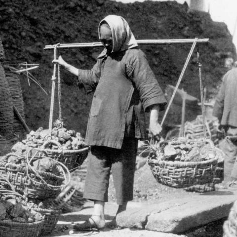Woman carrying coal Woman carrying coal